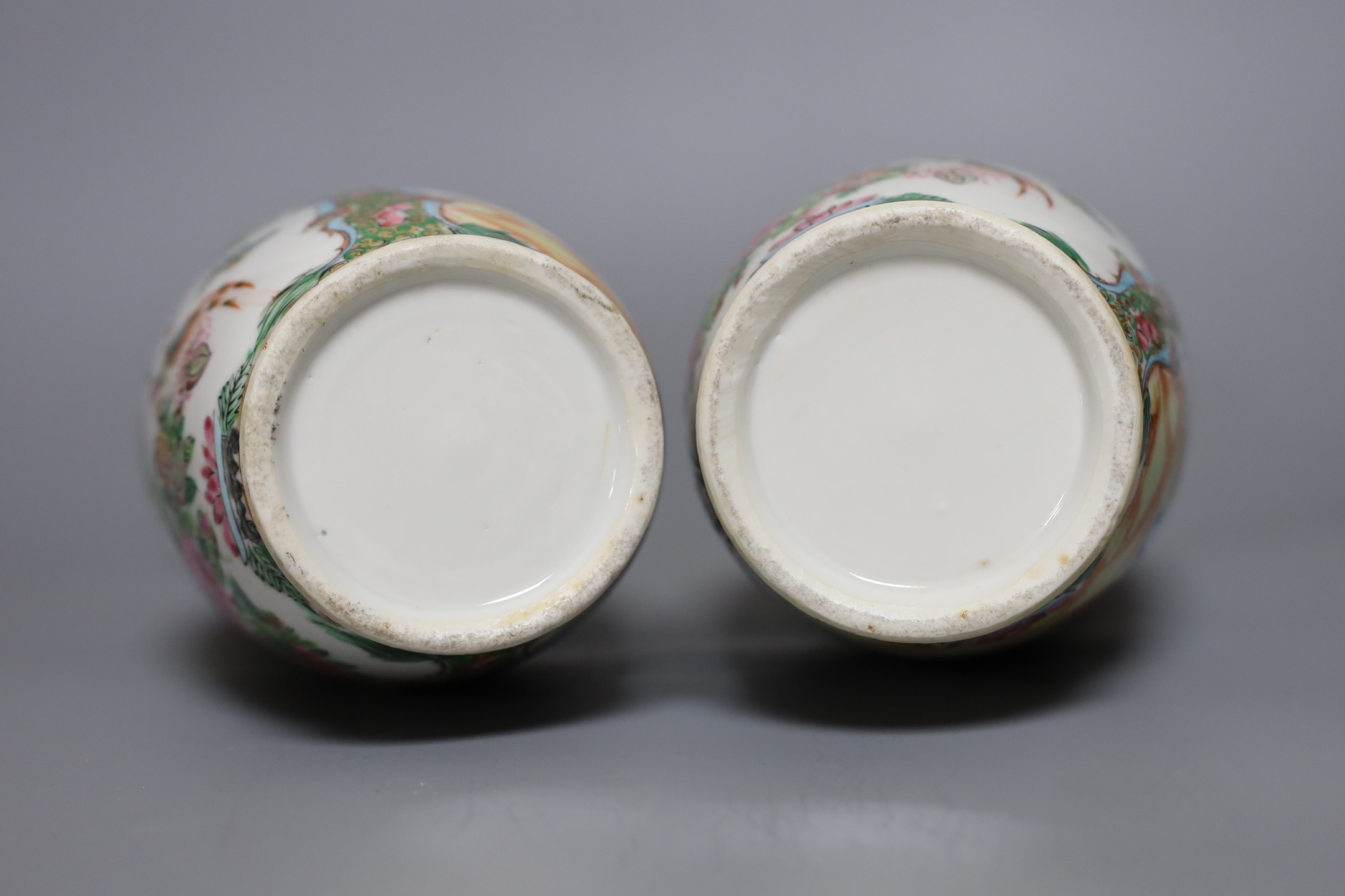 A pair of 19th century Chinese Canton ceramic vases, 25.5cm tall